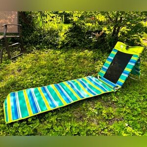 Beach folding lounger.